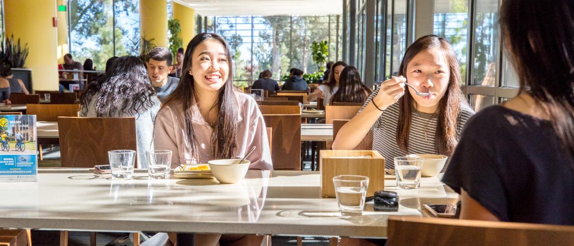 two students eating at Feast